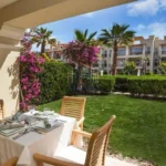 Terrace view of swimming pool and gardens in Sahl Hasheesh