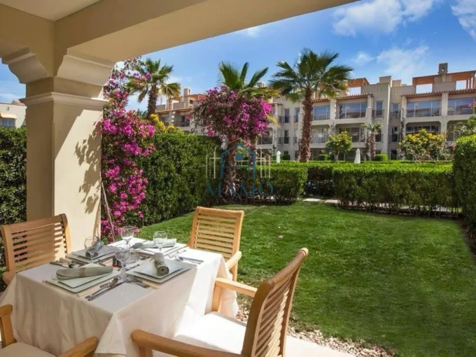 Terrace view of swimming pool and gardens in Sahl Hasheesh