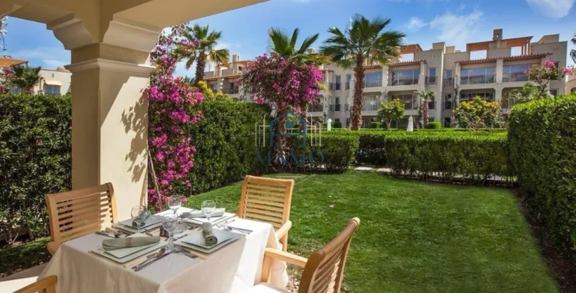 Terrace view of swimming pool and gardens in Sahl Hasheesh